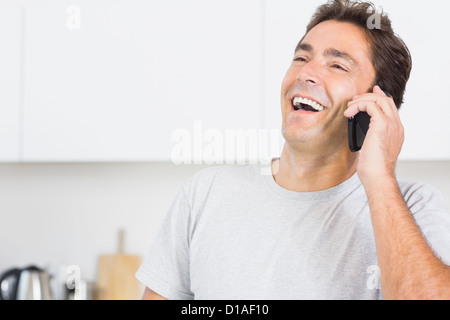 Man laughing on the phone Stock Photo