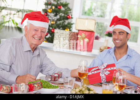 Family swapping christmas presents Stock Photo - Alamy