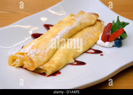 Pancakes with cottage cheese on a white plate Stock Photo