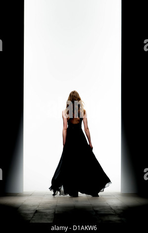 A model displays a creation by designer PPQ during a fashion show at London Fashion Week. Stock Photo