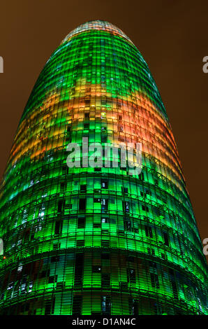 Barcelona, Spain. 12th December 2012 -- The Torre Agbar pictured lit up for the Christmas season with more than 4,500 lights that can operate independently using LED technology displaying a seasonal design out of moving lights and colors in Barcelona. -- The Torre Agbar, a 38-story skyscraper and an example of high-tech architecture on Barcelona's skyline, adds to the city's traditional Christmas lighting, displaying an original decoration of moving lights and colors using LED technology. Stock Photo