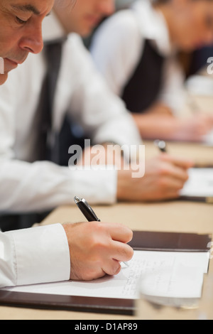Businessman making notes Stock Photo