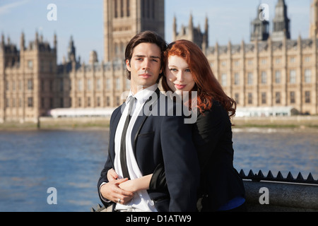 Portrait young business couple sitting together  Big Ben tower Stock Photo