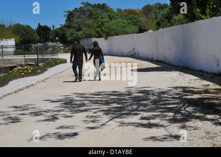 A couple walking hand in hand. Stock Photo