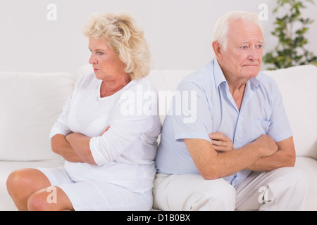 Unhappy woman being angry against an old man Stock Photo