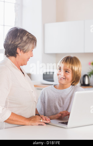 Granny and grandson using laptop Stock Photo
