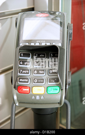 Machine terminal for transaction in Post Office for collecting pension or state benefits Stock Photo