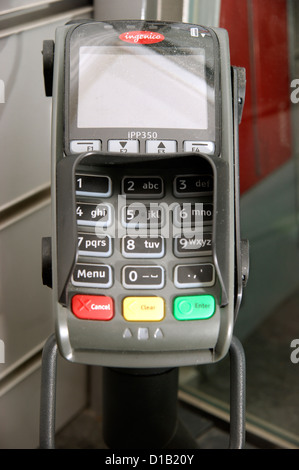 Machine terminal for transaction in Post Office for collecting pension or state benefits Stock Photo