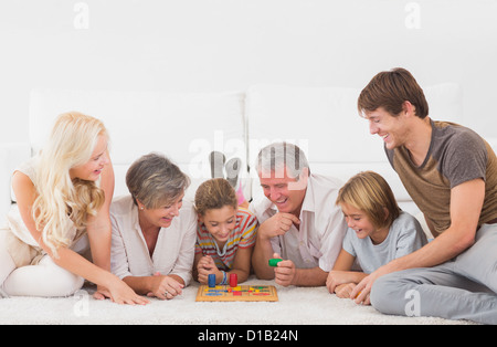 Family playing board games Stock Photo
