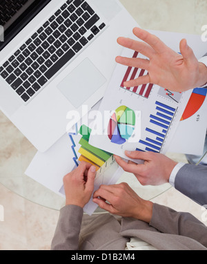 Business process analysts looking at research data Stock Photo