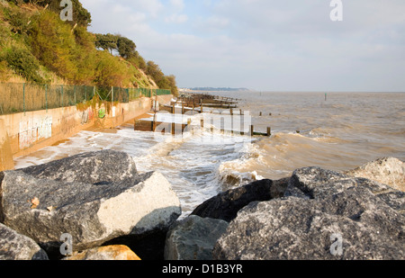 Waves wooden groynes sea defences Cobbold's Point, Felixstowe, Suffolk, England Stock Photo