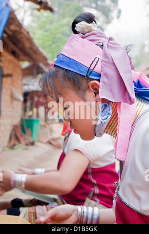 Women from the Kayan minority group working on woven fabric, Huai Seau Tao, Mae Hong Son Province, Thailand Stock Photo