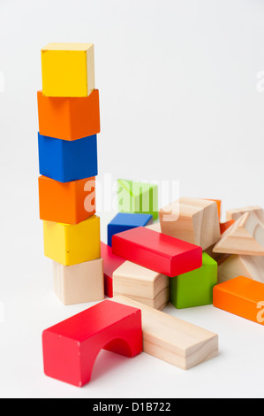 Childrens toy building blocks of different shapes and colours. Stock Photo