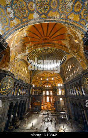 Golden domes frescoes and crooked Qiblah wall inside the Hagia Sophia with wood pendants Istanbul Turkey Stock Photo