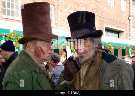 unsavoury characters dressed in traditional period clothing entertain visitors at the victorian festival of christmas portsmouth Stock Photo