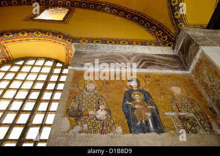 Mosaic on upper level of Hagia Sophia of Mary with Christ child and Emperor John Comnenus Empress Irene son Elexius Istanbul Turkey Stock Photo