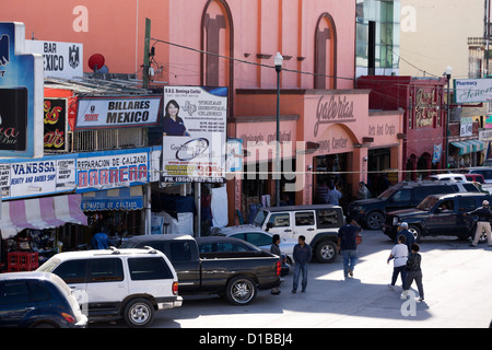 Downtown street scene in Nuevo Progreso, Tamaulipas, Mexico. Locals and tourists strolling in the main street of town. Stock Photo