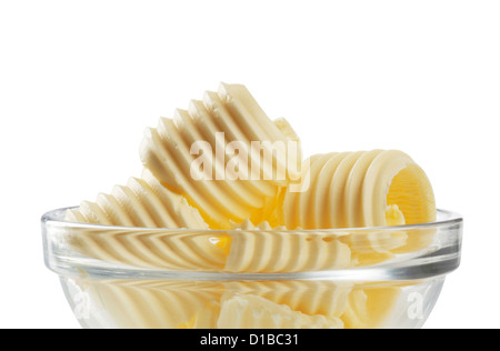 Curls of fresh butter in a bowl Stock Photo