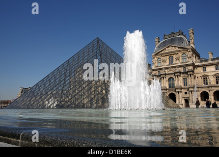 Paris, France, the Louvre glass pyramid Richelieufluegel and fountains Stock Photo