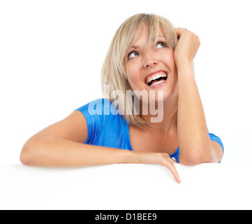 Portrait of a young smiling happy woman looking up with daydreaming expression. Isolated on white background. Stock Photo