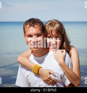 portrait of happy couple on the beach Stock Photo