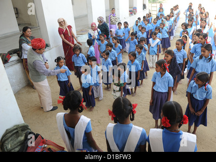 Students stand in rows during the morning roll call before class at the girls' school in Mundia near Jaipur, India, 19 November 2012. Bahadur Singh Rajawat (l) donated the premises for the school with his brother. It is also supported by means of the German development association 'Mädchenschule Mundia' (Girls' School Mundia), which is based in Monheim, Germany. Photo: Jens Kalaene Stock Photo