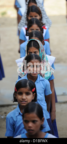 Students stand in rows during the morning roll call before class at the girls' school in Mundia near Jaipur, India, 19 November 2012. Bahadur Singh Rajawat donated the premises for the school with his brother. It is also supported by means of the German development association 'Mädchenschule Mundia' (Girls' School Mundia), which is based in Monheim, Germany. Photo: Jens Kalaene Stock Photo