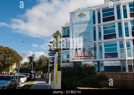 Modern old peoples home using image of aged surfers in Bondi, surfers paradise. Stock Photo
