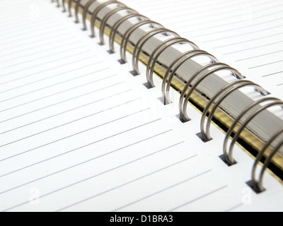 Open blank sheet of a diary with metal spiral binding Stock Photo