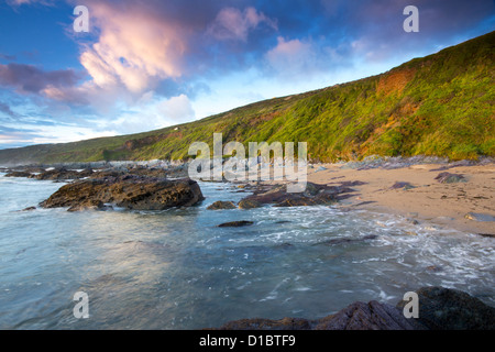 Twilight approaches over Polhawn Beach Whitsand Bay Cornwall UK Stock Photo