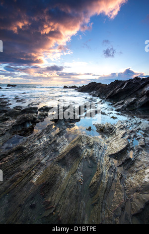 Twilight approaches over Polhawn Beach Whitsand Bay Cornwall UK Stock Photo