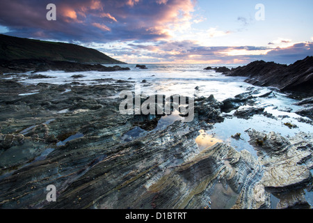 Twilight approaches over Polhawn Beach Whitsand Bay Cornwall UK Stock Photo