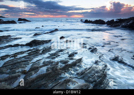 Twilight approaches over Polhawn Beach Whitsand Bay Cornwall UK Stock Photo
