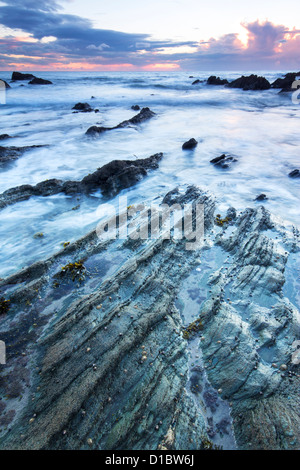 Twilight approaches over Polhawn Beach Whitsand Bay Cornwall UK Stock Photo