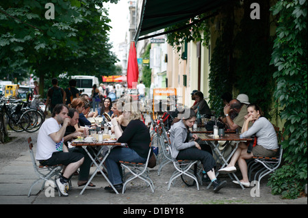 Berlin, Germany, guests sit at a street cafe in Kastanienallee Stock Photo