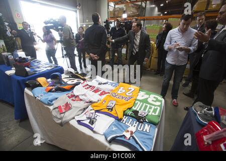 Dec. 14, 2012 - Los Angeles, California (CA, United States - U.S. Customs and Border Protection officers show some of the numerous counterfeit items intercepted this week at a Los Angeles-area cargo processing facility as part of Operation Holiday Hoax during a media conference Friday, December 14, 2012 in Los Angels, California, USA. The Operation conducted by officers and import specialists from U.S. Customs and Border Protection (CBP) and agents from U.S. Immigration and Customs Enforcement's (ICE) Homeland Security Investigations (HSI), resulted in the interdiction of a wide variety of sus Stock Photo