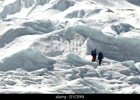 Nepal, Mount Everest. Climbers return to base camp after navigating the Khumbu Icefall at the base of Mount Everest. Stock Photo