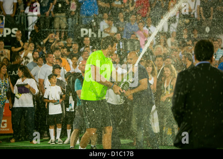 Juan Martin Del Potro throwing champagne during and exhibition match vs Roger Federer in Buenos Aires on December 2012 Stock Photo