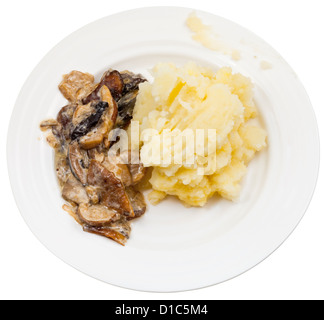 top view stewed mushrooms and mashed potatoes on plate isolated on white background Stock Photo
