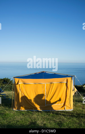 Camping on a field overlooking the sea at East Prawle, Devon. Stock Photo