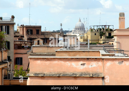 Roofs in Rome and the Basilica of Saint Peter in the background from the Quirinale Hill in Rome - Italy Stock Photo