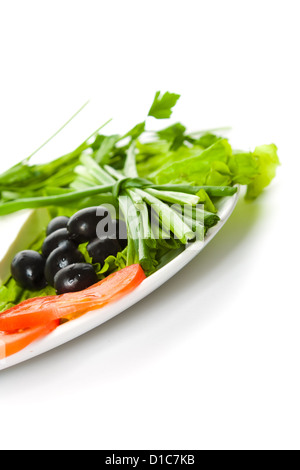 Picture of plate with different vegetables isolated on white Stock Photo