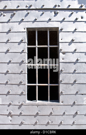 Ancient metal prison door with iron bars Stock Photo
