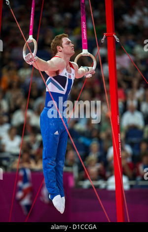 Daniel Purvis (GBR) competing on the rings during the Men's Individual All-Around at the 2012 Olympic Summer Games Stock Photo