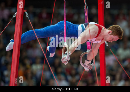 Daniel Purvis (GBR) competing on the rings during the Men's Individual All-Around at the 2012 Olympic Summer Games Stock Photo