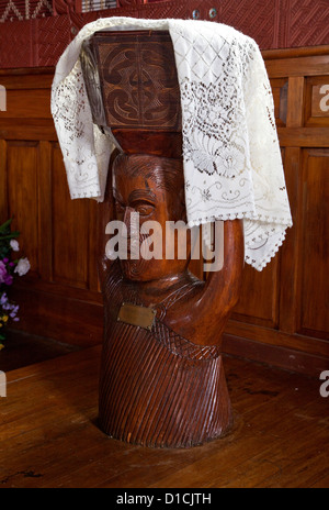 Baptismal Font, St. Mary's Anglican Church, Tikitiki, New Zealand.  Cultural Syncretism. Stock Photo