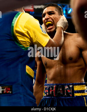 Dec. 15, 2012 - Los Angeles, CA, US -  AMIR KHAN is readied for the scheduled 12-round fight at the Los Angeles Sports Arena between Khan and CARLOS MOLINA for the vacant WBC Silver Super Lightweight Title.  Referee Jack Reiss stopped the bout after the 10th round at the urging of Molina's corner.(Credit Image: © Brian Cahn/ZUMAPRESS.com) Stock Photo