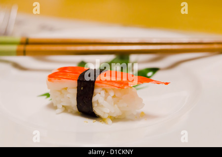 Crab meat sticks sushi with seaweed on white plate, japanese cuisine Stock Photo