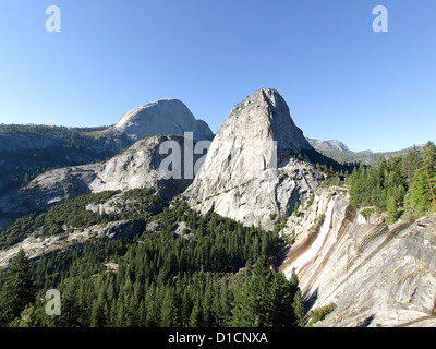 Great point of view along the Mist Trail featuring, from right to left, Nevada Fall, Liberty Cap, and the back of Half Dome. Stock Photo
