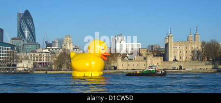 Stunt on River Thames with large yellow duck being towed past the City of London skyline promoting the Jackpotjoy bingo website Stock Photo